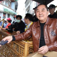 Thousands line up at temple in southern Taiwan for lucky new year coins